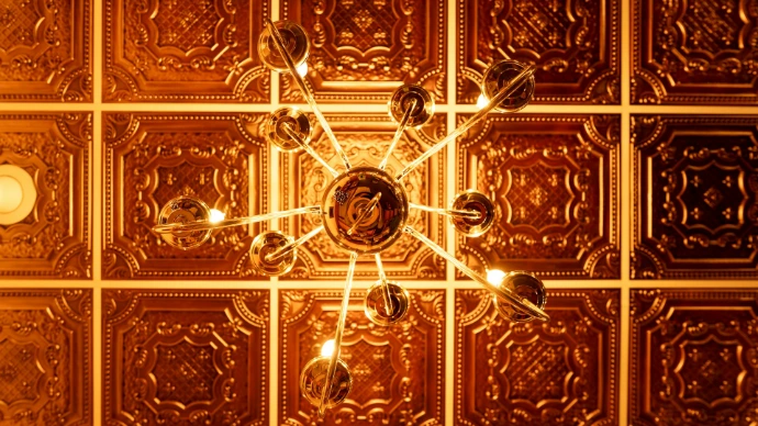 a chandelier hanging from the ceiling in a room